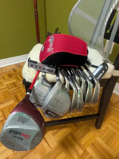 Wilson golf bag and driver plus 12 right handed golf clubs, View more