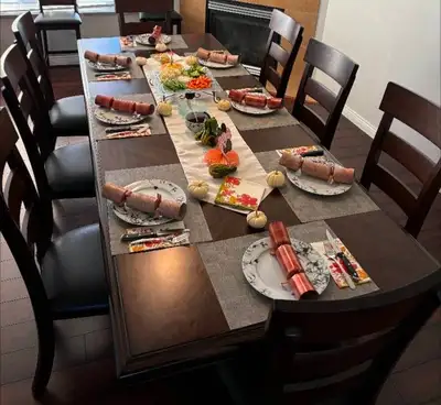 Table 90x42 plus 18 inch self storing leaf plus 8 chairs. We are changing this set for a smaller one...