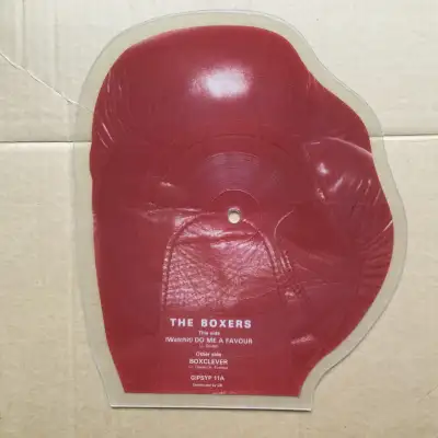 This is a UK Picture Disc Record of Boxing Glove by Boxers Side A: Do Me A Favour : Side B: BoxCleve...