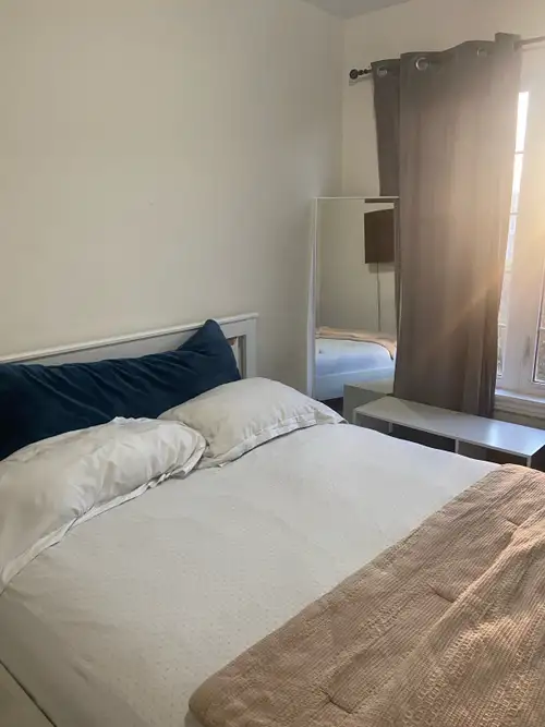 This bedroom with shared washroom is available for rent and offers a comfortable living space. It fe...