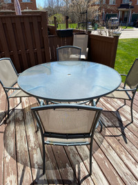 58” round glass patio table  with 4 chairs