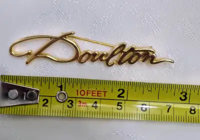 Vintage gold tone Pin, "Doulton" perfume, View more
