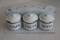 Vintage style enamel kitchen/laundry canister set with a rack