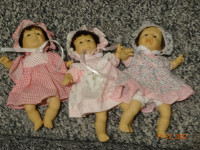 3  little 8 inch dolls, pellet filled body,  all orig dress, hat