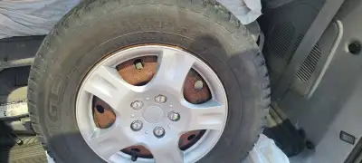 These are four Champiro Winterpro tires, size P215/60R16 on steel rims, and they're looking for a ne...