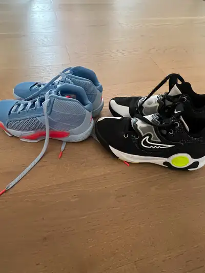 $25 each or both for $40. Black are size 7. Purple are size 6.5. Our son used for bball. Always in d...