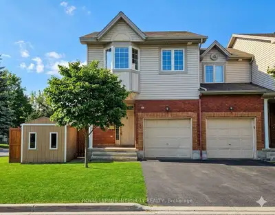 Fully furnished end-unit townhome in a highly convenient location near Trainyards, CHEO, and the Gen...
