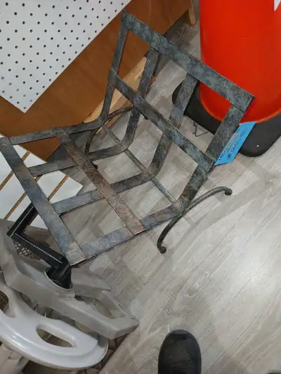 All cast metal wood rack for stacking your fireplace wood.