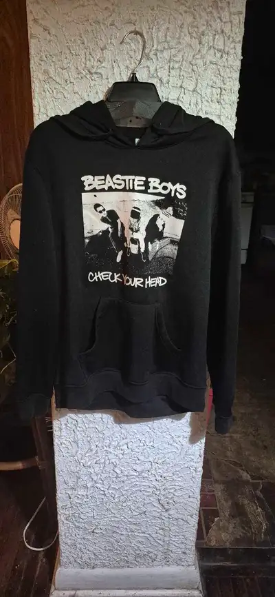 This is a used Beastie Boys 'Check Your Head' hoodie. A cool piece for any fan! This hoodie features...