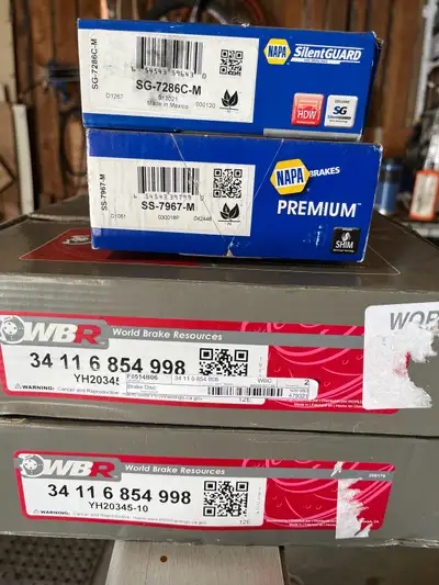 2 new rotors and complete set of brake pads for a 323