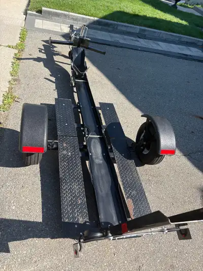 Stinger foldable single motorcycle trailer with integrated ramp. Holds 1775 lbs. very low profile an...