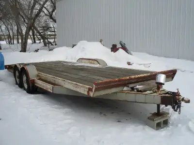 Heavy duty tandem car hauling trailer and 300 gallon plastic water tank. Please call 241.5668 (306 a...