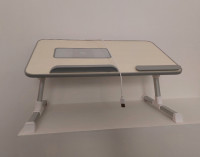 Adjustable laptop table with cooling fan