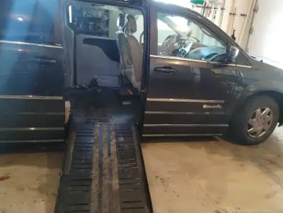 handicap accessible van, leather interior,heated seats, heated steering wheel,tilt out ramp, extra s...