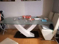 Elegant dinner table protected with plastic & 6 leather chairs