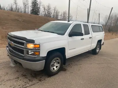 This reliable Chevrolet Silverado 1500 is ready for work or play! This 2014 white pickup truck comes...