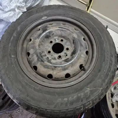 4 pcs of Arctic Claw Winter Txi Winter Tires, 215-65-r16, with 4 steel rims on, from a Caravan. $10...
