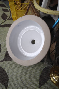 compact round porcelain undermount sink.  New!