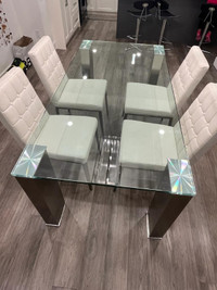 Contemporary tempered glass table and four chairs