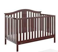 Graco Solano 4 in 1 convertible crib with a mattress