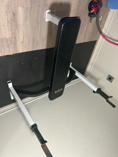 Heavy duty weightlifting bench $200 7 foot weightlifting bar 45 pounds $70 1-35 pound plate $50 4 –1...