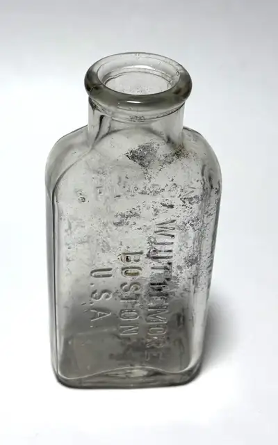Vintage embossed glass bottle marked: 5 Fluid Oz Whittemore Boston U.S.A. Nice old clear glass bottl...