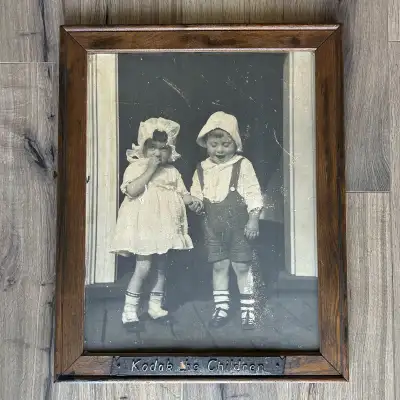 An original Kodak dealer display sign printed on real photo paper. This would have hung in the photo...