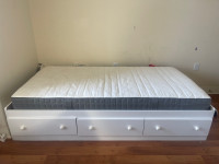 Twin bed with a mattress 