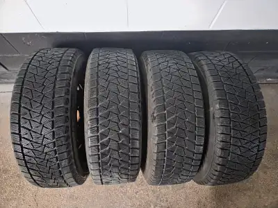 Selling a full set of 4 Bridgestone Blizzak DM-V2 winter tires on 17" steel rims – size 235/65R17 10...