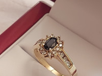 Yellow gold sapphire and 18 diamonds ring ..Stamped 10K . Size 7