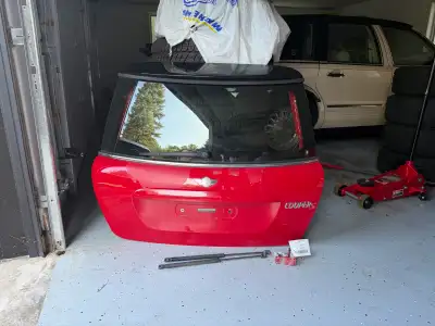 This is a red Mini Cooper S trunk hatch, featuring the glass window, rear wiper, and necessary mount...