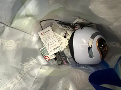 I am selling a used nail kit for at-home use, including nails, glue, and a solar UV light. This comp...