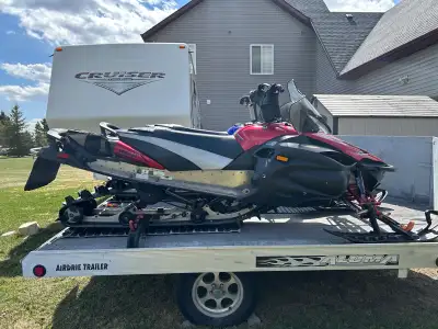 Two 2007 Yamaha Apex Mountain sleds with drive on drive off Aluma snowmobile trailer. Sleds are in e...