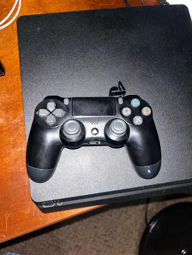 Sony playstation 4 , with a charger628643621753631223