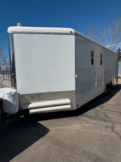 2022 Forest River Cargo Mate 24ft. plus 4ft nose. the trailer is divided into 12ft. cargo space and...