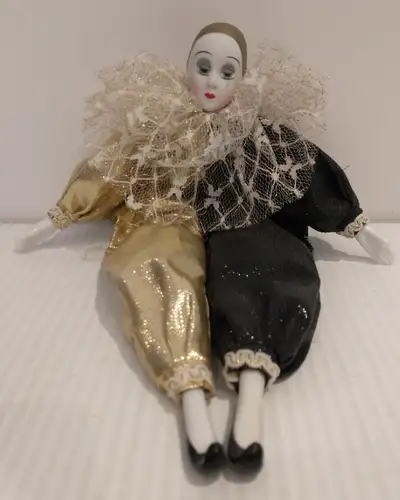Black and gold costume with ruffle Approximately 12 inches Stand not included No cracks or chips, mi...
