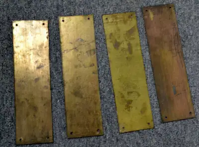 These are four commercial grade, sold brass push plates that were to be used on shop doors that you...