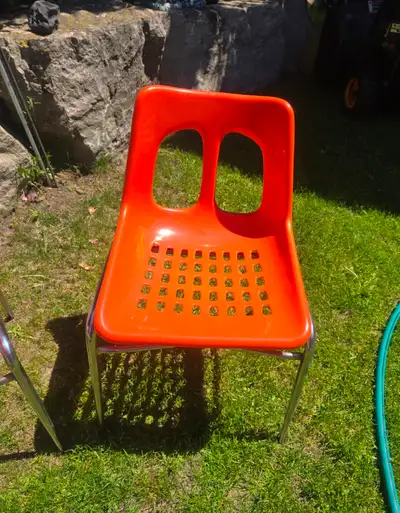 1970’s stacking orange plastic and chrome chairs, View more