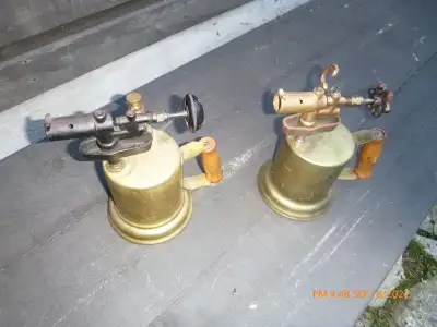2 BRASS TORCHES ARE IS EXCELLENT SHAPE. USED AS DOOR STOPS. $60 EACH OR 2 FOR $100. tarnished one mo...