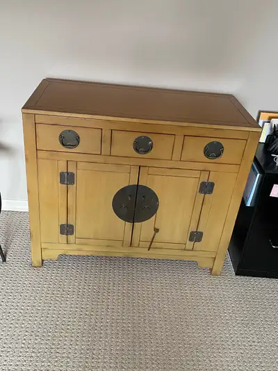 I have a butterscotch-colored solid wood cabinet for sale. It is from Pier 1. The dimensions are 33...