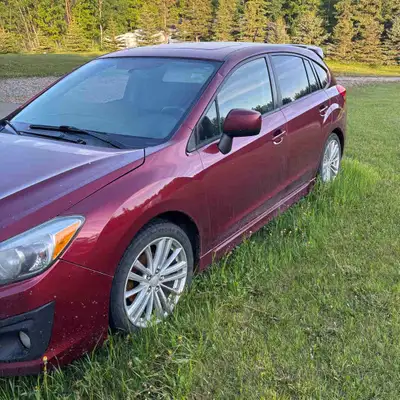 This 2013 Subaru Impreza AWD features a reliable all-wheel-drive system and a versatile hatchback de...