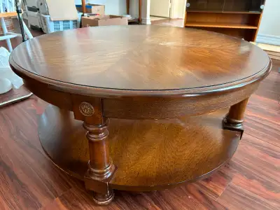 The sturdy circular coffee table stands 17” high with a diameter of 36”. There is also a round shelf...