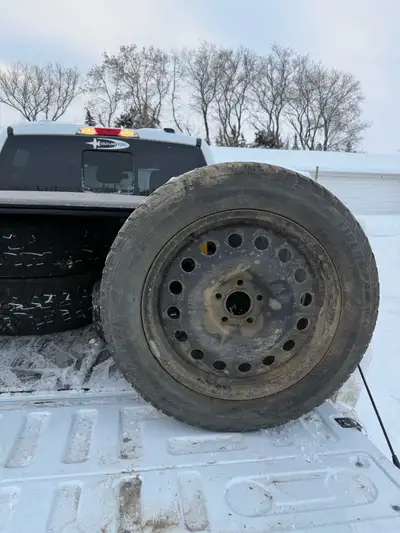 Winter tires and rims for sale. 235 55R17 off a ford escape. Sold the car no longer need the tires....