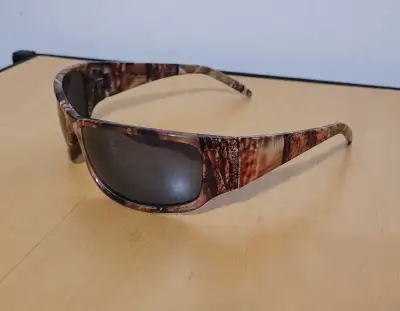 Camo sunglasses in good condition. Pick up is out near the esso on garven road, details will be give...