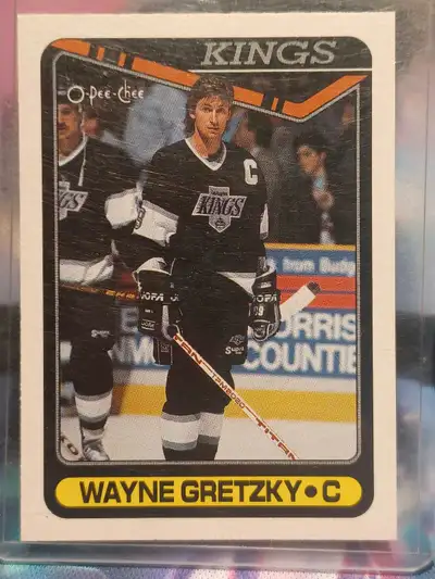 This is a used 1990 O-Pee-Chee Wayne Gretzky Kings hockey card, a collectible piece of sports memora...