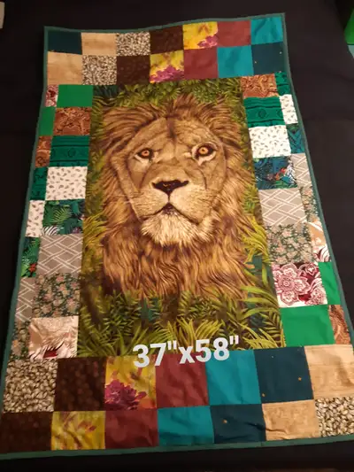 Handmade lion lap blanket. 37x58 inches. Reverse is plush dark green terry cloth. Must be picked up...