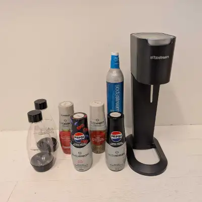 Everything you need to make pop at home, just add water! Includes: - 1 SodaStream machine - 1 partia...