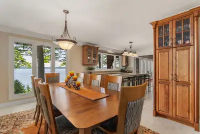 Table with 2 leaves to expand length up to 12 seating. Includes Wood Chairs w/Fabric back & seats (2...