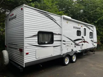 2013 Forest River Wildwood 28DBUD travel trailer in very tidy condition inside and out. One slide-ou...