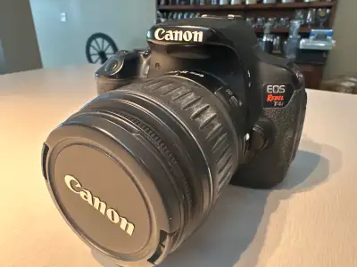 Capture your memories with this pre-owned, excellent condition Canon EOS Rebel T4i, a versatile DSLR...